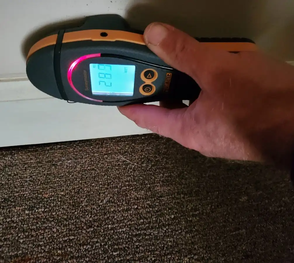 Moisture detection at baseboard during Burst Pipe Cleanup in Chardon